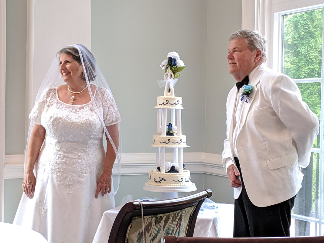 Bride and Groom at their Wedding Cake - My Big Fat Greek Wedding Dinner Event at The Elms